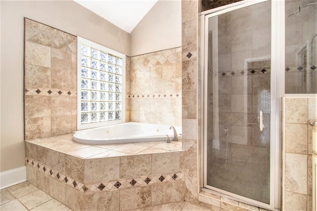 bathroom with lofted ceiling, separate shower and tub, and tile patterned flooring