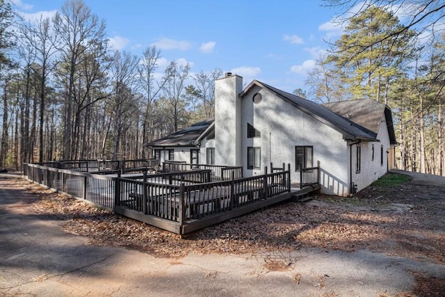 exterior space featuring a wooden deck