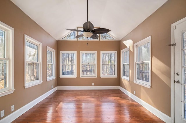 unfurnished sunroom with ceiling fan and lofted ceiling