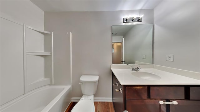 full bathroom with hardwood / wood-style flooring, vanity, toilet, and shower / bath combination