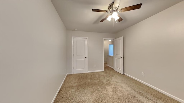 unfurnished bedroom with light carpet and ceiling fan