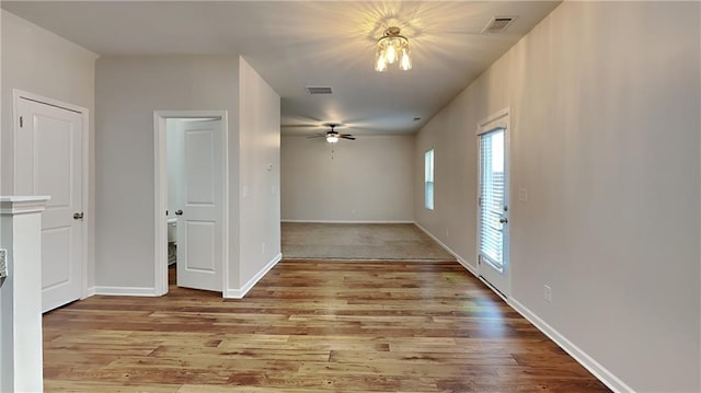 spare room featuring ceiling fan and light hardwood / wood-style floors