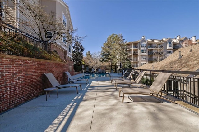 view of patio / terrace featuring a community pool