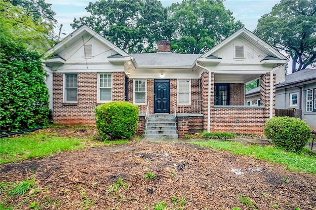 1615 Stokes Ave SW, Atlanta, GA 30310 - bungalow-style house with brick siding and a chimney