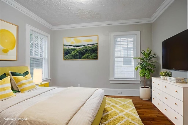 1615 Stokes Ave SW, Atlanta, GA 30310 - bedroom with dark wood-type flooring, a textured ceiling, crown molding, and baseboards