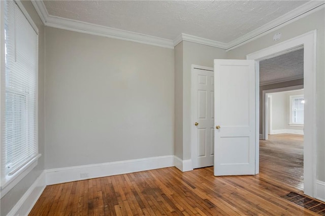 1615 Stokes Ave SW, Atlanta, GA 30310 - empty room featuring hardwood / wood-style floors, crown molding, baseboards, and a smoke detector