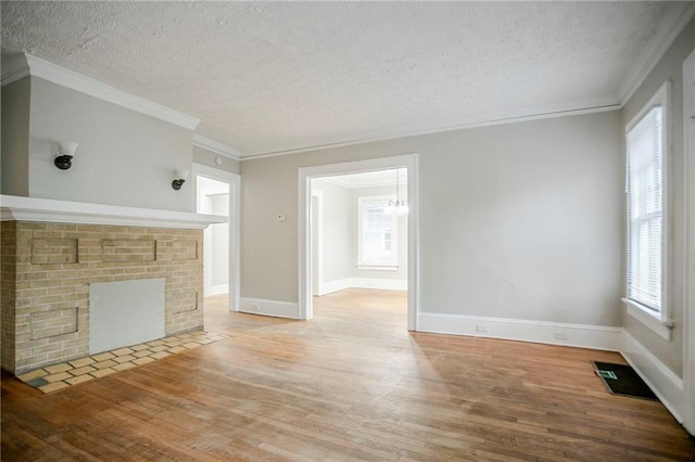 1615 Stokes Ave SW, Atlanta, GA 30310 - unfurnished living room with a textured ceiling, wood finished floors, a chandelier, ornamental molding, and baseboards