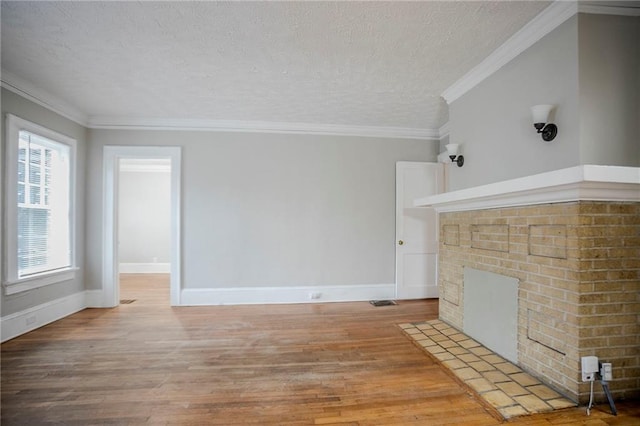 1615 Stokes Ave SW, Atlanta, GA 30310 - unfurnished living room featuring a textured ceiling, light wood-style floors, baseboards, and a fireplace