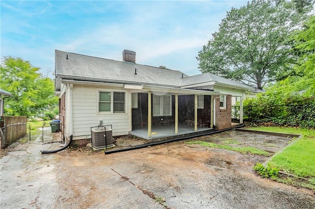 1615 Stokes Ave SW, Atlanta, GA 30310 - back of house with a chimney and central AC