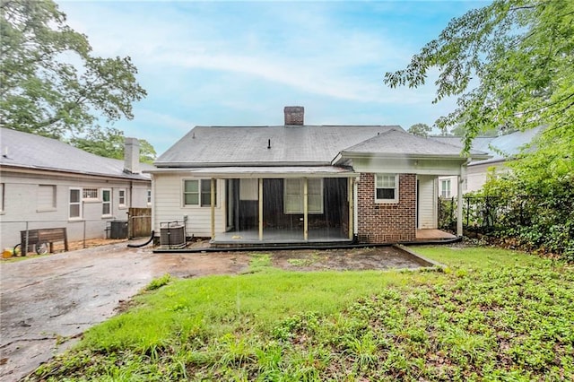 1615 Stokes Ave SW, Atlanta, GA 30310 - rear view of house featuring a chimney, cooling unit, and brick siding