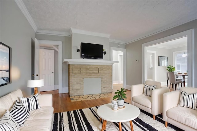 1615 Stokes Ave SW, Atlanta, GA 30310 - living area with a brick fireplace, wood finished floors, ornamental molding, and baseboards