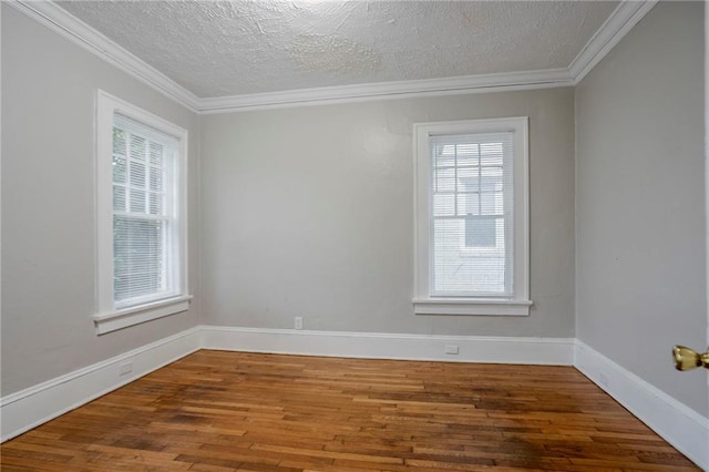 1615 Stokes Ave SW, Atlanta, GA 30310 - unfurnished room with wood finished floors, a textured ceiling, ornamental molding, and baseboards