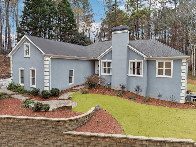 view of front of property with a garage and a front yard