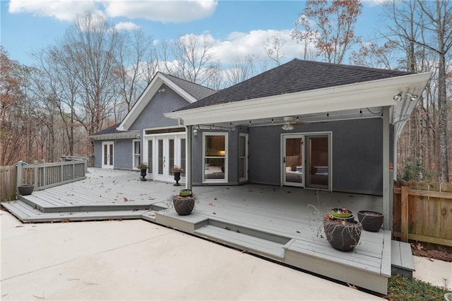 rear view of house with a deck, ceiling fan, and french doors