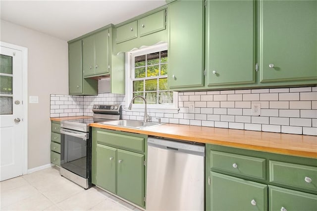 532 Watson St, Toccoa, GA 30577 - kitchen with stainless steel appliances, decorative backsplash, and light tile patterned flooring