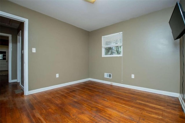 empty room featuring dark hardwood / wood-style floors