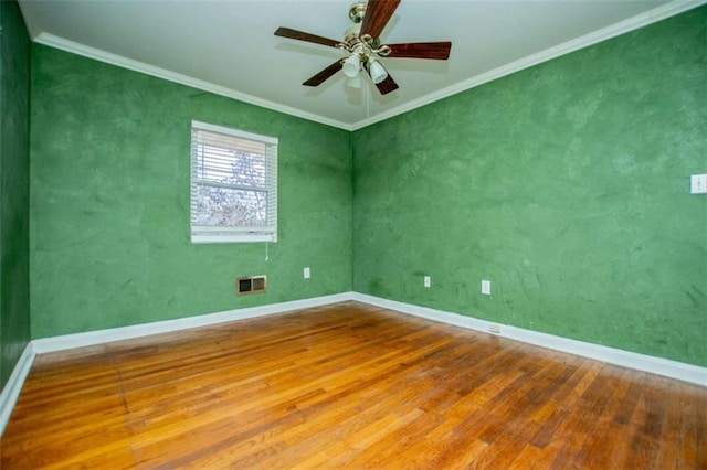 unfurnished room with hardwood / wood-style flooring, crown molding, and ceiling fan