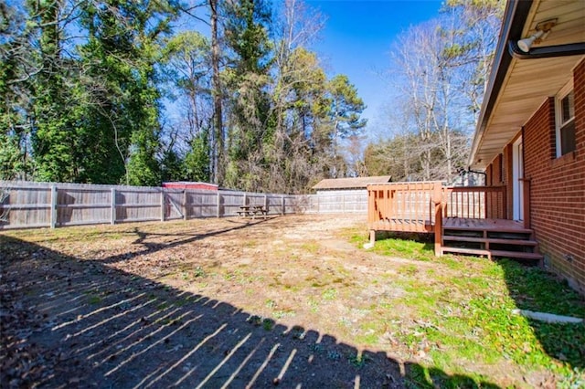 view of yard with a wooden deck