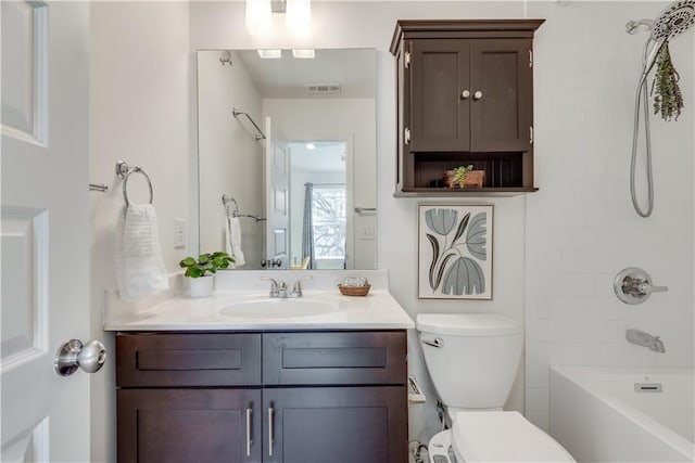 bathroom with tub / shower combination, visible vents, toilet, and vanity