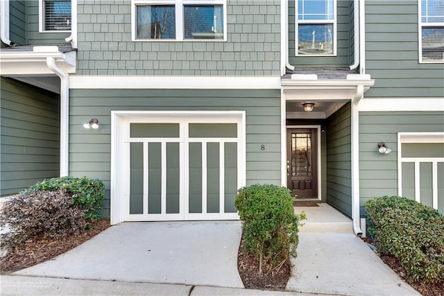 doorway to property with an attached garage