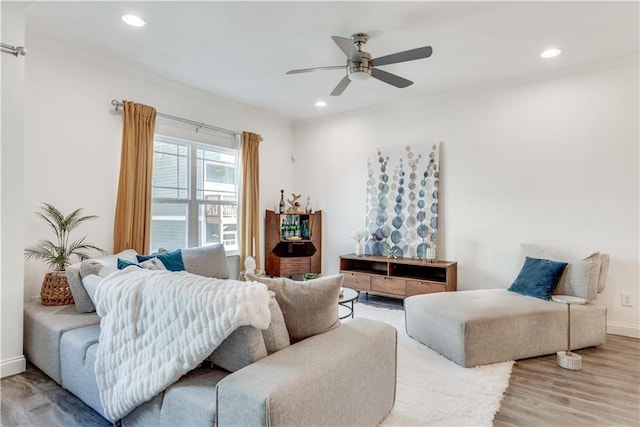 living room with recessed lighting, baseboards, ceiling fan, and wood finished floors