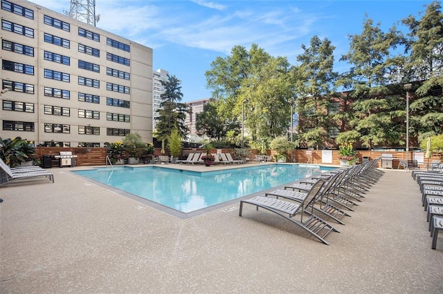 view of swimming pool featuring a patio