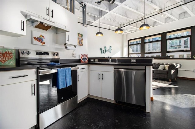 kitchen with hanging light fixtures, appliances with stainless steel finishes, sink, and white cabinets