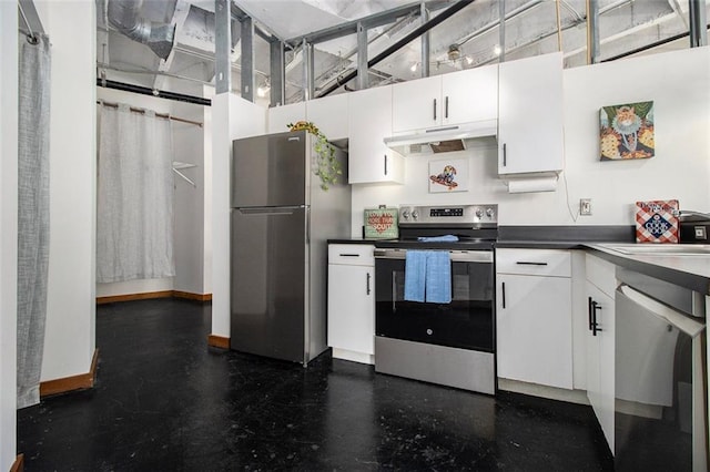 kitchen featuring a towering ceiling, stainless steel appliances, and white cabinets