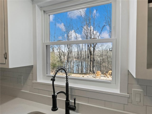 2938 Chestatee Rd, Gainesville, GA 30506 - room details with a sink, tasteful backsplash, and white cabinetry