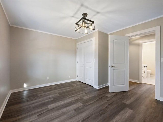 2938 Chestatee Rd, Gainesville, GA 30506 - unfurnished dining area with an inviting chandelier, baseboards, ornamental molding, and dark wood finished floors