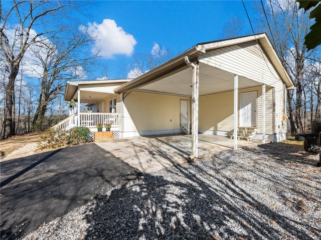 2938 Chestatee Rd, Gainesville, GA 30506 - view of side of property featuring entry steps, covered porch, an attached carport, and driveway