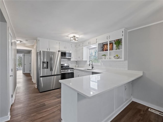 2938 Chestatee Rd, Gainesville, GA 30506 - kitchen with stainless steel appliances, baseboards, a sink, and tasteful backsplash