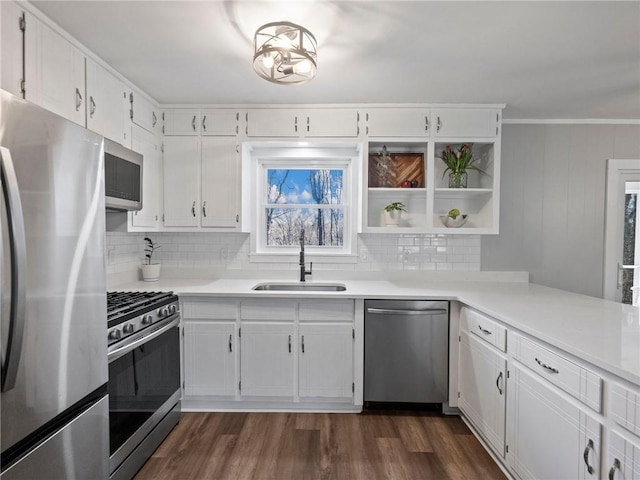 2938 Chestatee Rd, Gainesville, GA 30506 - kitchen with white cabinets, dark wood-style flooring, appliances with stainless steel finishes, a sink, and tasteful backsplash