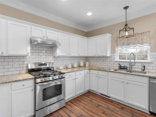 kitchen with stainless steel appliances, white cabinetry, hanging light fixtures, and sink