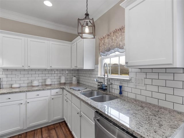 kitchen featuring white cabinetry and sink