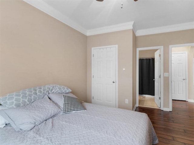 bedroom with dark hardwood / wood-style flooring, crown molding, and ceiling fan