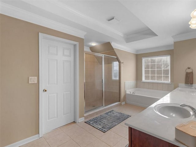 bathroom with vanity, tile patterned floors, ornamental molding, and shower with separate bathtub