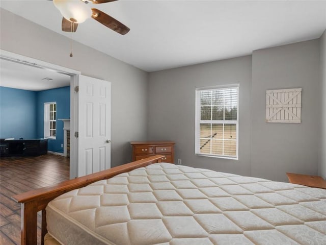 bedroom featuring hardwood / wood-style flooring and ceiling fan