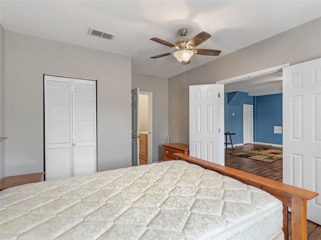 bedroom with hardwood / wood-style flooring and ceiling fan