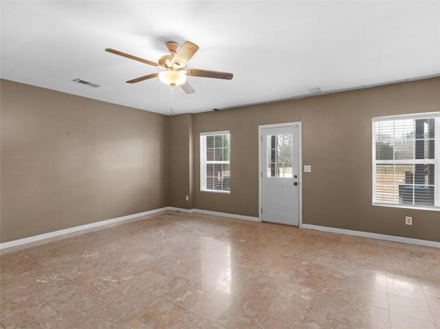 unfurnished room with ceiling fan