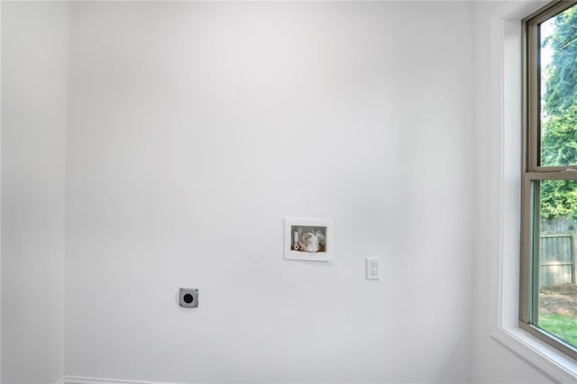 laundry room featuring hookup for an electric dryer, hookup for a washing machine, and baseboards