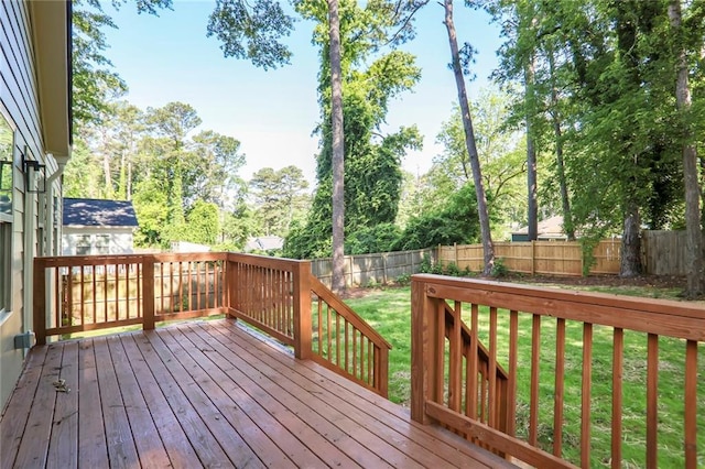 wooden deck with view of scattered trees