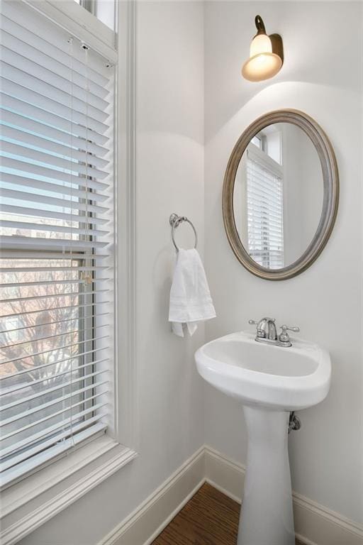 bathroom with wood-type flooring