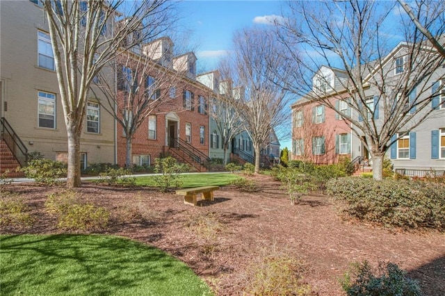 view of home's community featuring a lawn