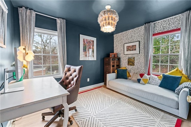 home office with plenty of natural light, baseboards, and a chandelier