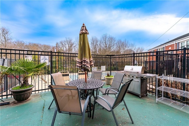 view of patio / terrace with a grill and outdoor dining space