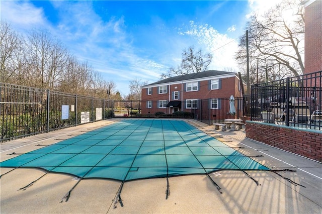 pool with fence and a patio