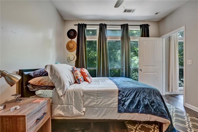 bedroom featuring ceiling fan and dark wood-type flooring