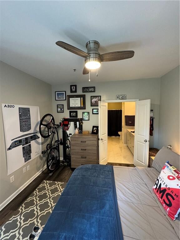 bedroom featuring ceiling fan and wood-type flooring