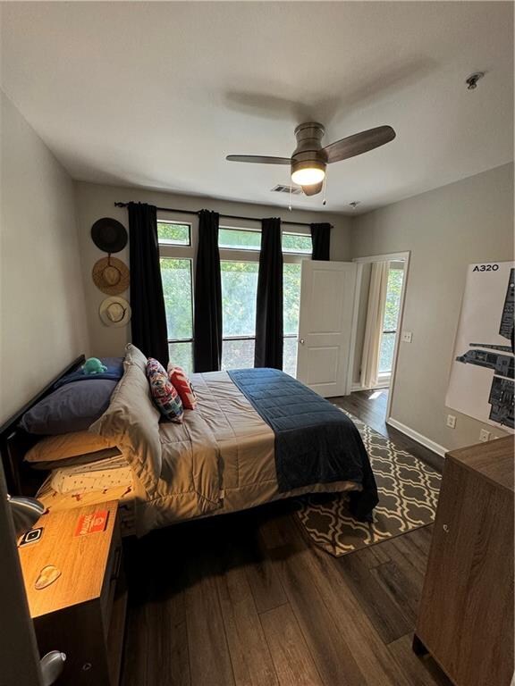 bedroom featuring ceiling fan and hardwood / wood-style flooring